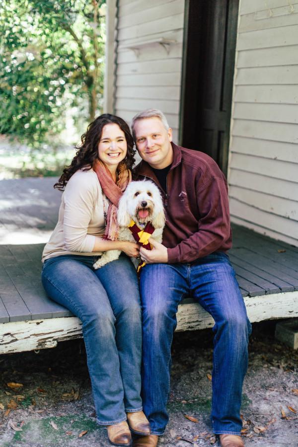 Above: Roland and her husband pose for a family picture with their dog.