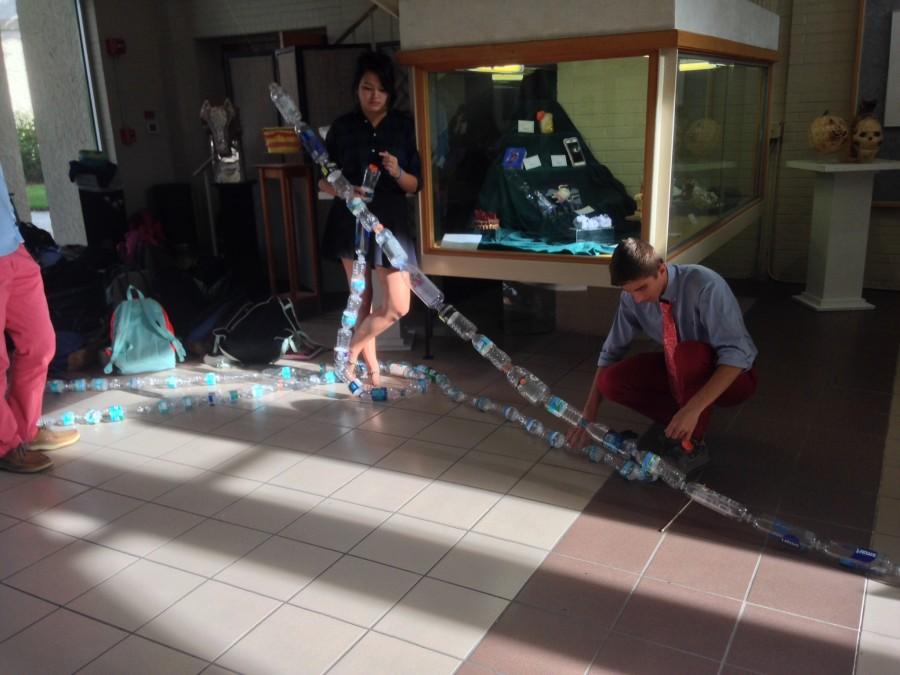 Environmental Science students make a train of water bottles.