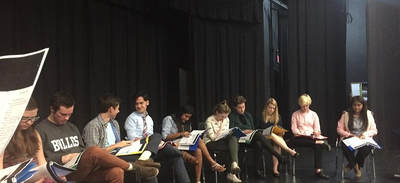 The cast of Midsummer/Jersey read lines from their scripts.