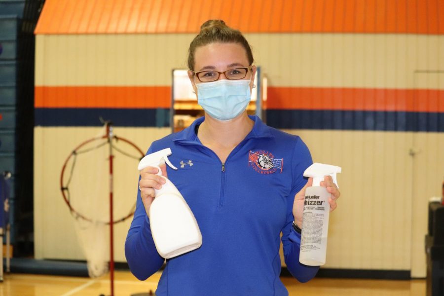 Coach Lee is equipped with disinfectant spray and a mask.