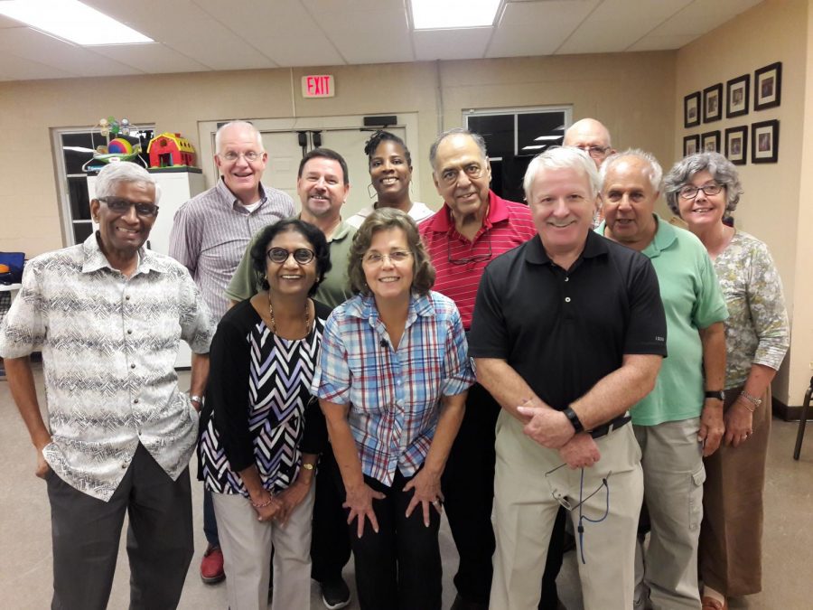 Wilkins (top middle) among her fellow poll workers. Photos can’t be taken during work hours so this was taken after the polls closed. (Credit: Katioa Wilkins)