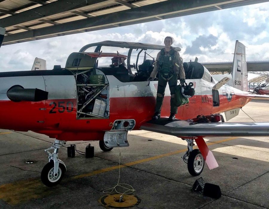 Gaitantzis proudly stands on the wing of her T-9 while it is being fueled and looked over. 