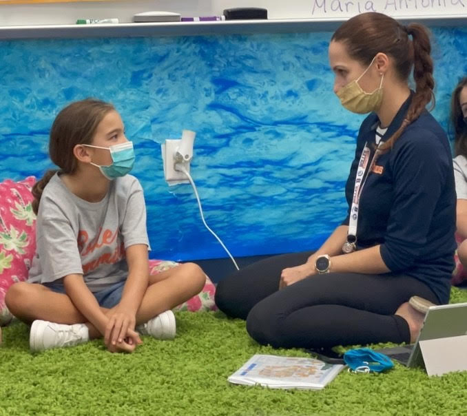 Aycart models respect while teaching her 4th grade students about cross-cultural communication and the pronunciation of the Spanish alphabet.