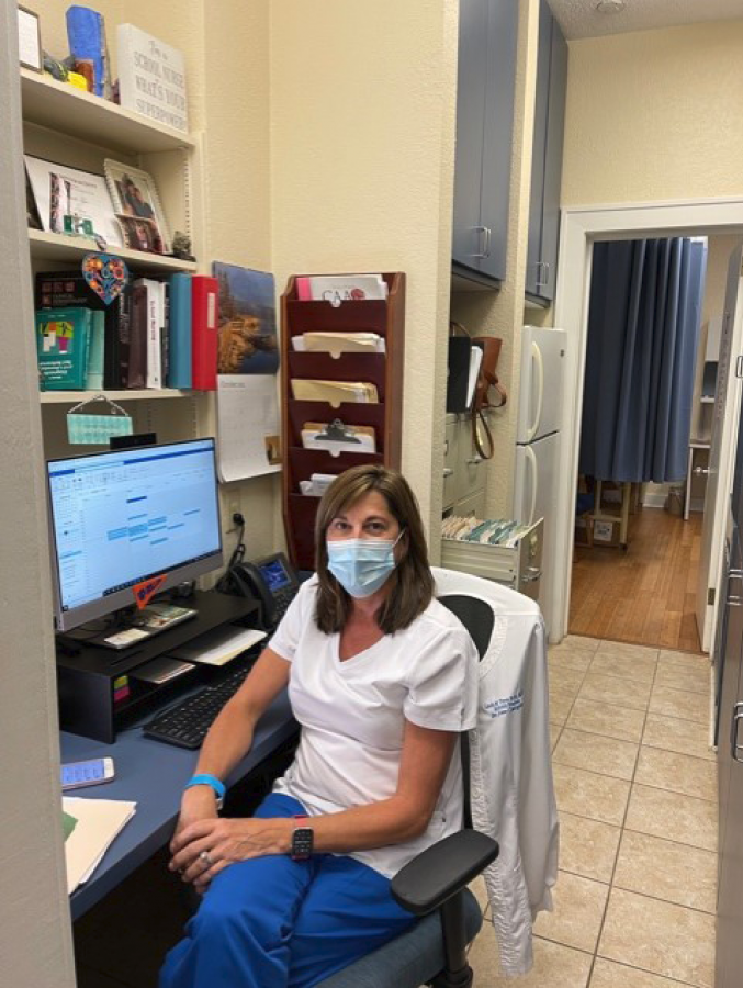 Nurse Tyre sits in her office.