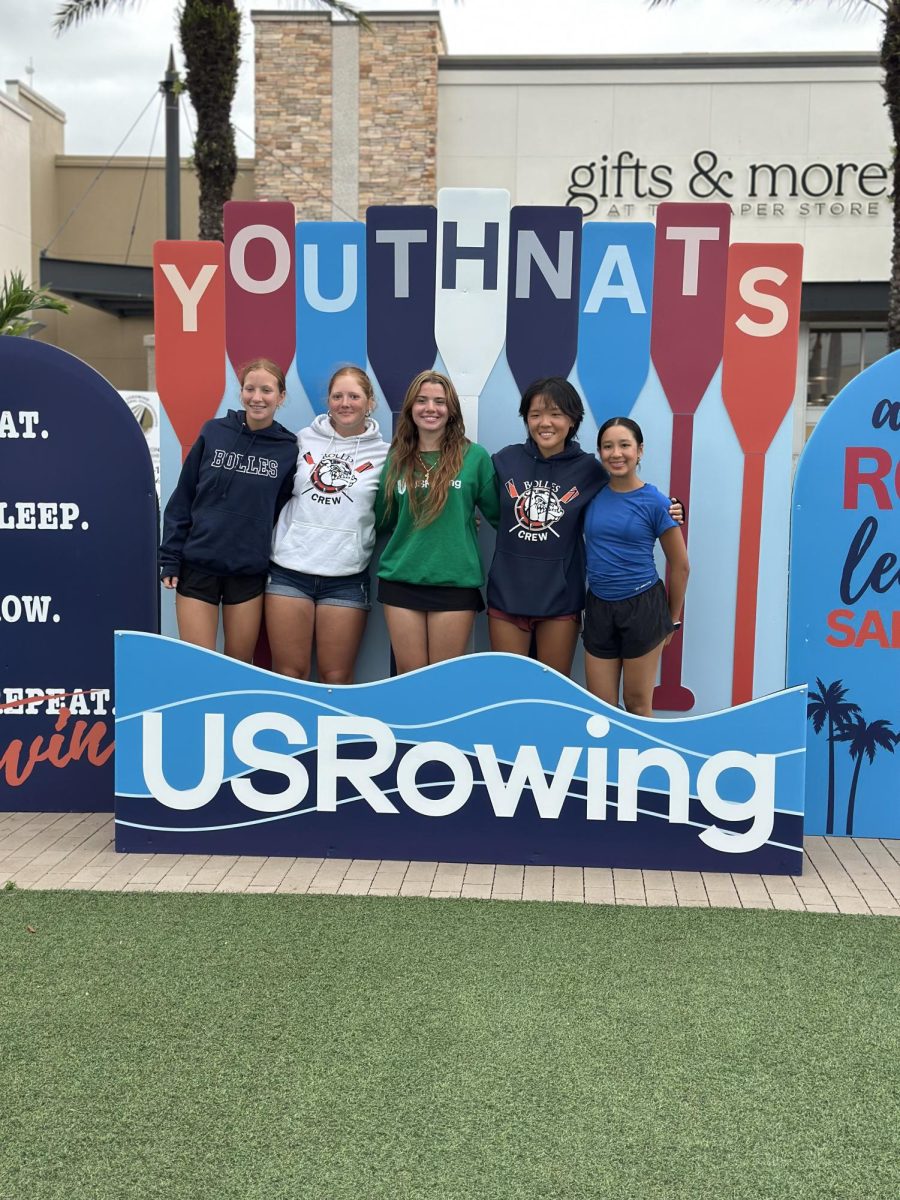 All of the girls in front of the welcome sign. Credit: Girls Crew Team