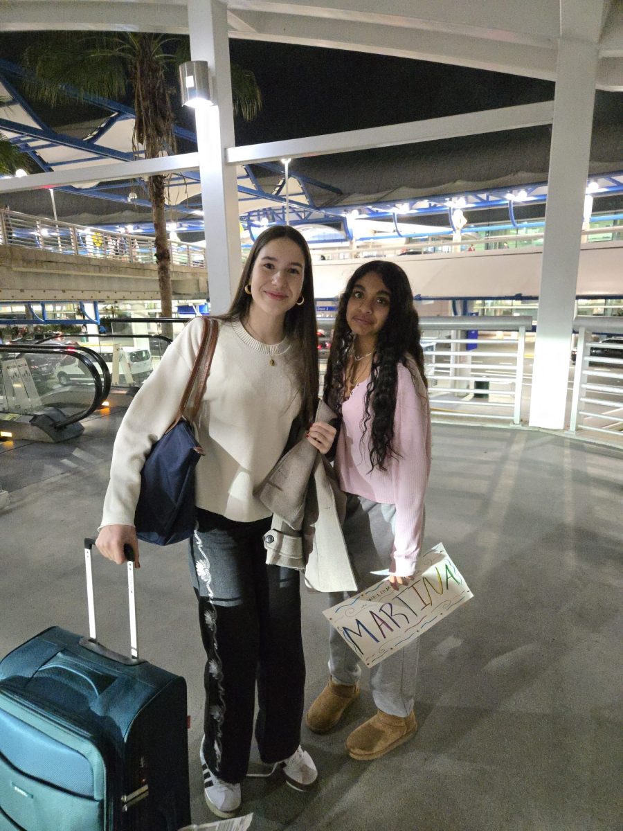Meera picking Martina up at the airport
